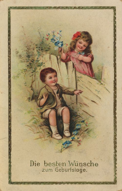 Kinderpaar am Gartenzaun